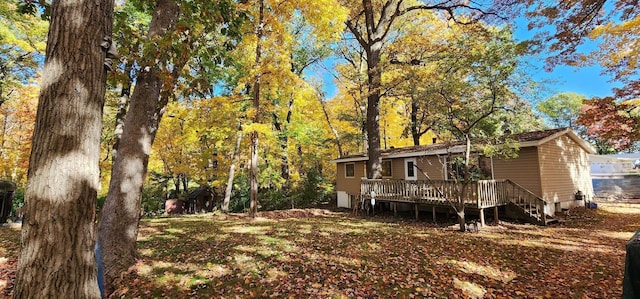 view of yard featuring a wooden deck