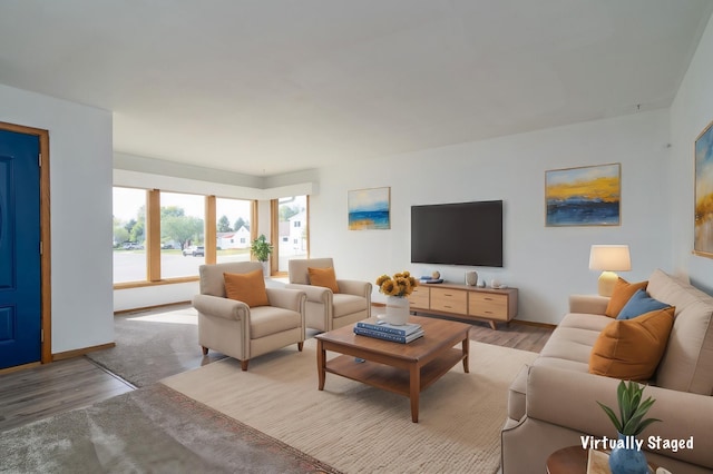 living room with light wood-style floors and baseboards