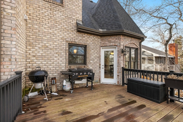 wooden terrace featuring area for grilling