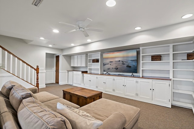 carpeted living area with visible vents, recessed lighting, stairway, and ceiling fan