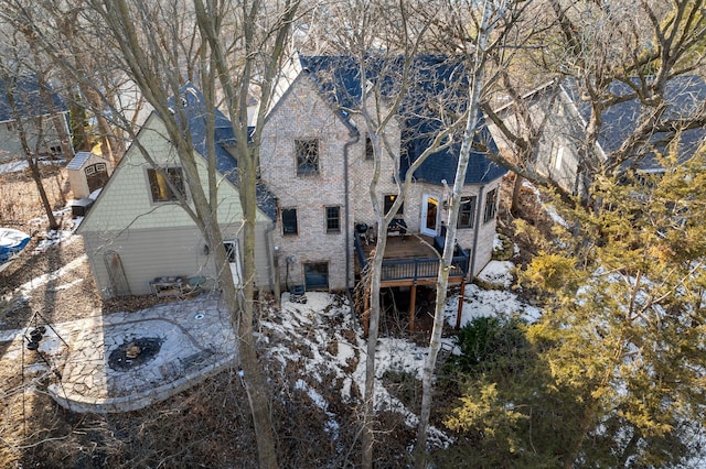 back of house with brick siding