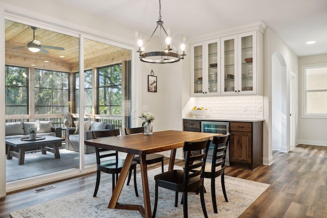 dining area with wood ceiling, baseboards, visible vents, and dark wood-type flooring