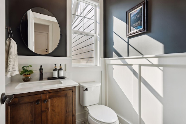 half bath with vanity and toilet