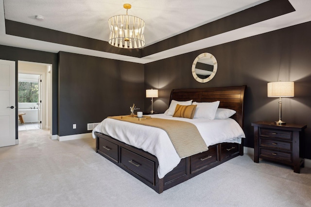 bedroom with light carpet, a chandelier, a raised ceiling, and baseboards