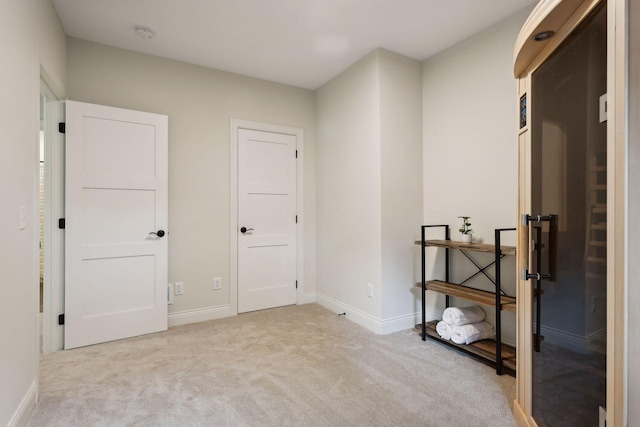 carpeted bedroom featuring baseboards