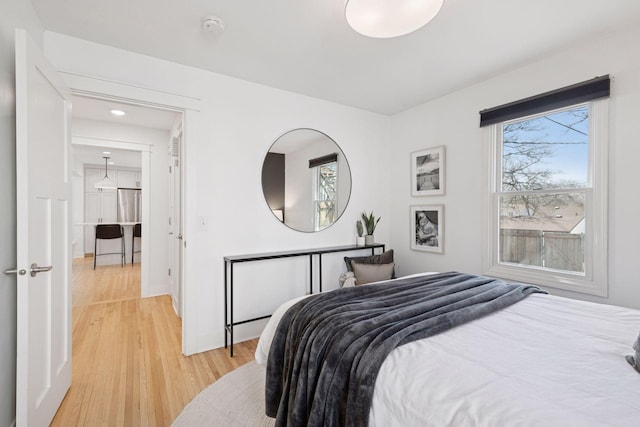 bedroom with light wood-type flooring