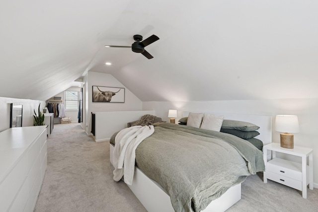 bedroom featuring light carpet, ceiling fan, and lofted ceiling