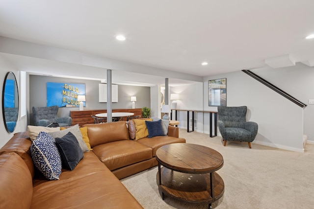 living area featuring light carpet, recessed lighting, and baseboards