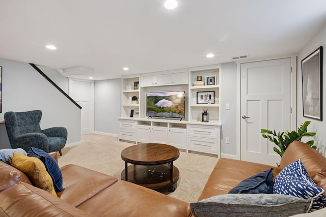 living area with recessed lighting, baseboards, and light carpet