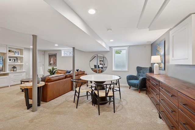 dining room featuring light carpet and recessed lighting