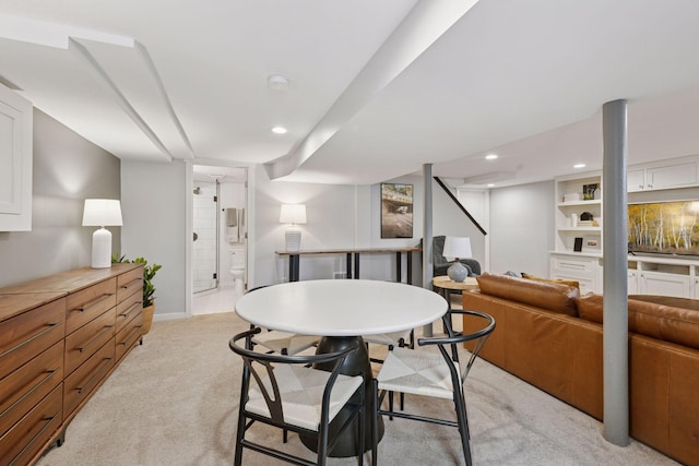 dining area with recessed lighting and light colored carpet