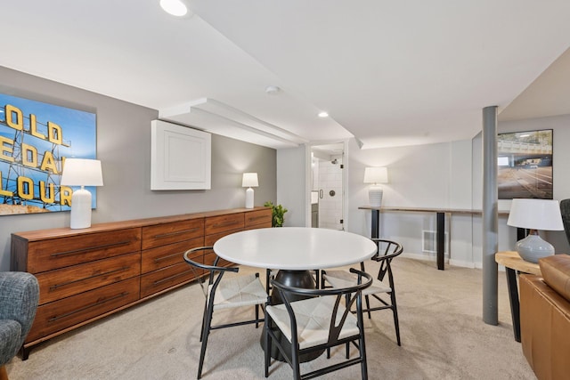 dining space featuring recessed lighting, baseboards, and light carpet