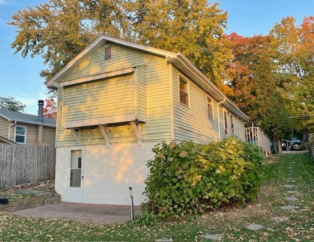 back of house featuring fence