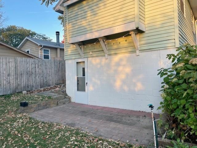 exterior space featuring a patio area and fence