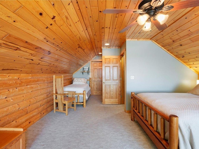 carpeted bedroom with wood ceiling and vaulted ceiling