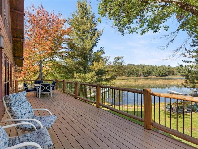 deck featuring a water view