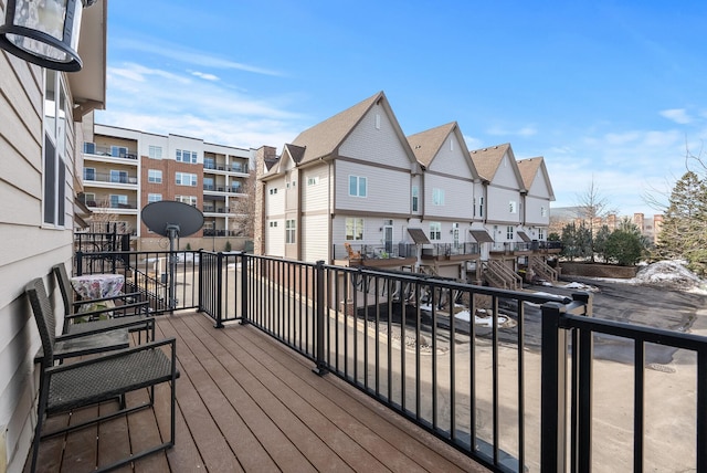 wooden deck with a residential view