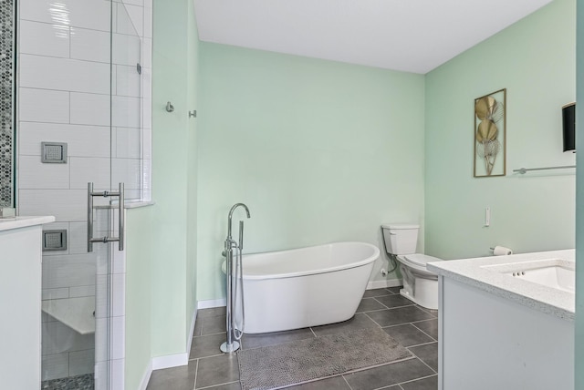 full bathroom featuring baseboards, a stall shower, tile patterned floors, a soaking tub, and vanity