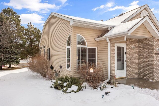 view of front of property featuring brick siding