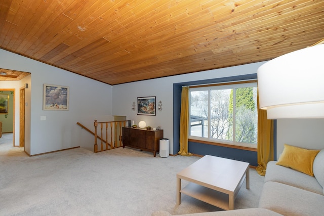 carpeted living area featuring vaulted ceiling, wood ceiling, and baseboards