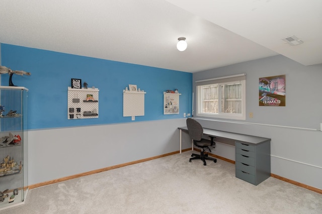 carpeted home office featuring baseboards and visible vents