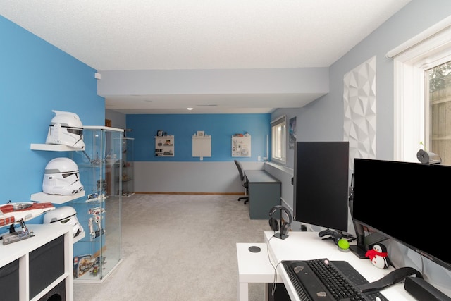 office with carpet, baseboards, and a textured ceiling