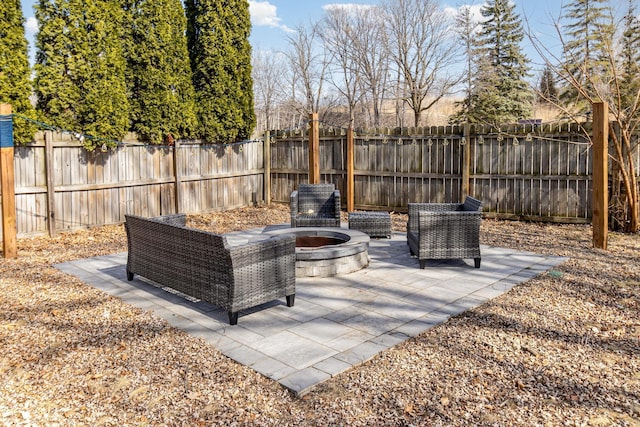 view of patio / terrace featuring a fire pit and a fenced backyard