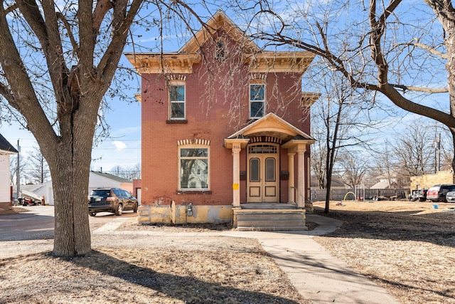 italianate-style house with brick siding