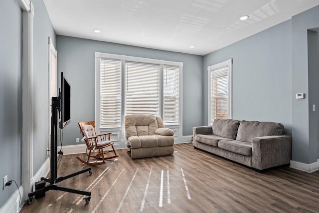 living room featuring recessed lighting, wood finished floors, and baseboards