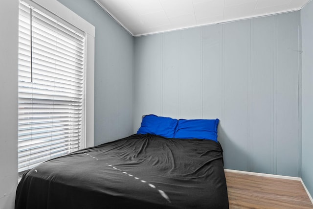 bedroom with wood finished floors