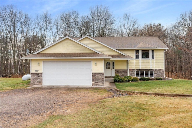 view of front of property with driveway, stone siding, and a front lawn