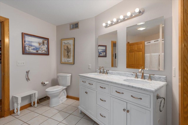 bathroom with toilet, a sink, visible vents, and tile patterned floors