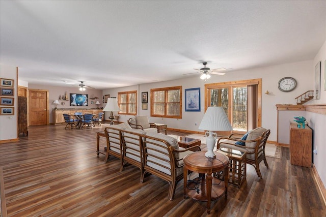 dining room with ceiling fan, baseboards, and wood finished floors