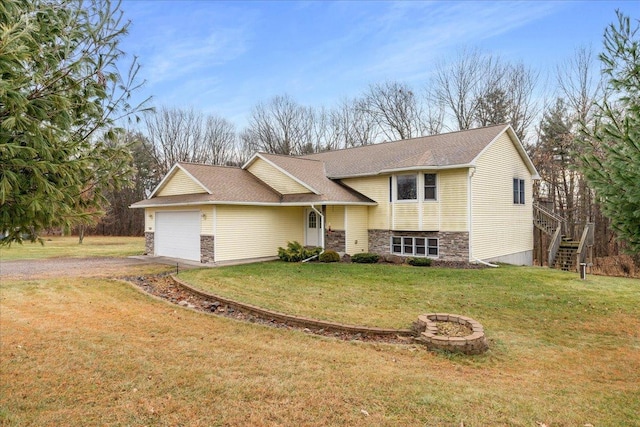 view of front facade with an attached garage, stairs, stone siding, driveway, and a front yard