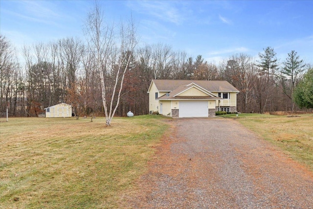 view of front of house with driveway, an outbuilding, an attached garage, a shed, and a front lawn