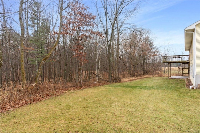 view of yard featuring a wooden deck