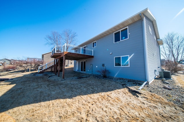 rear view of house with a deck, stairway, and central air condition unit