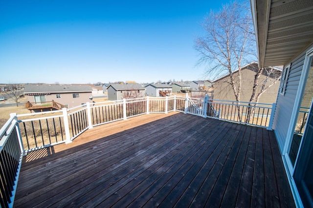 wooden deck featuring a residential view