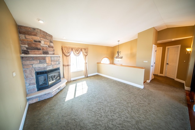 unfurnished living room with lofted ceiling, carpet, and baseboards