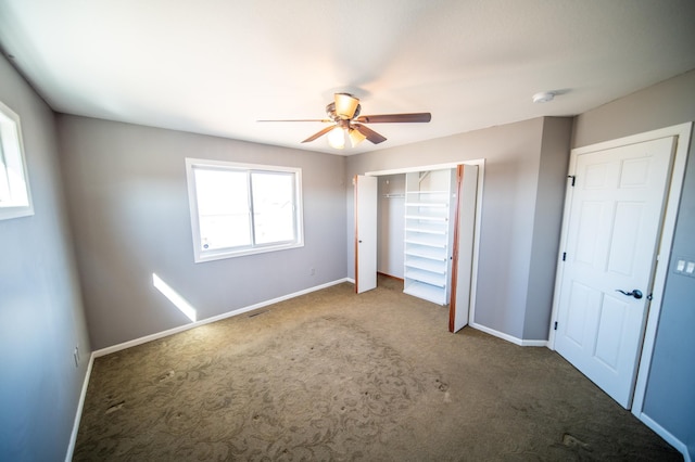 unfurnished bedroom featuring visible vents, baseboards, ceiling fan, carpet floors, and a closet