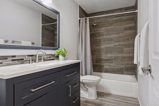 full bath with vanity, toilet, shower / bathtub combination with curtain, decorative backsplash, and wood finished floors