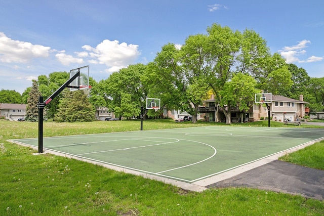 view of sport court featuring a lawn and community basketball court