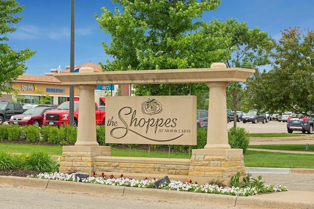 community sign with uncovered parking