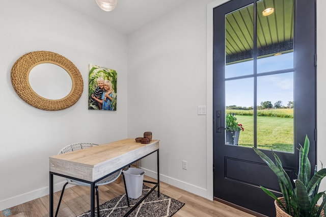 office area with wood finished floors and baseboards