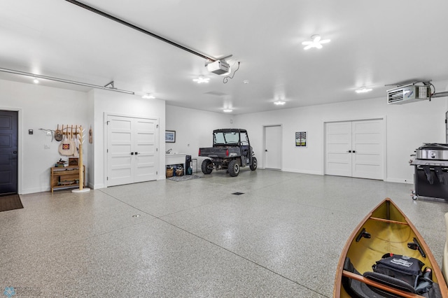 garage featuring baseboards and a garage door opener