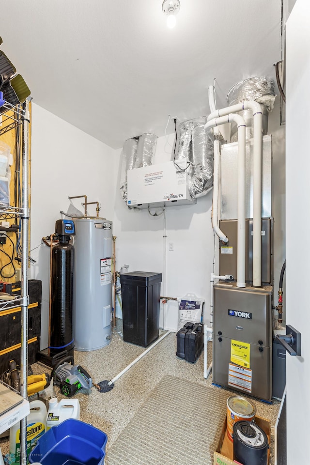 utility room featuring water heater