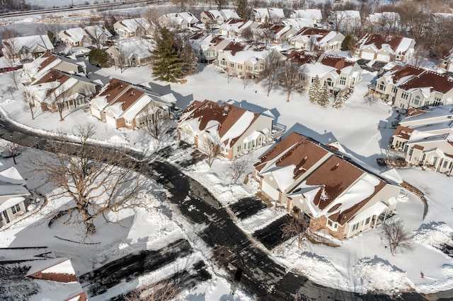 snowy aerial view featuring a residential view