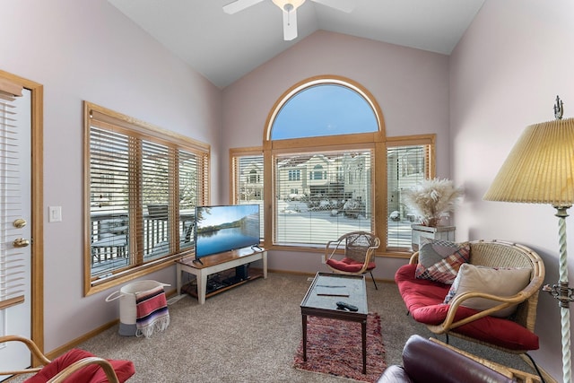 carpeted living room featuring high vaulted ceiling, ceiling fan, and baseboards