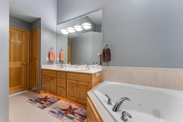 bathroom with tile patterned flooring, a sink, a jetted tub, and double vanity