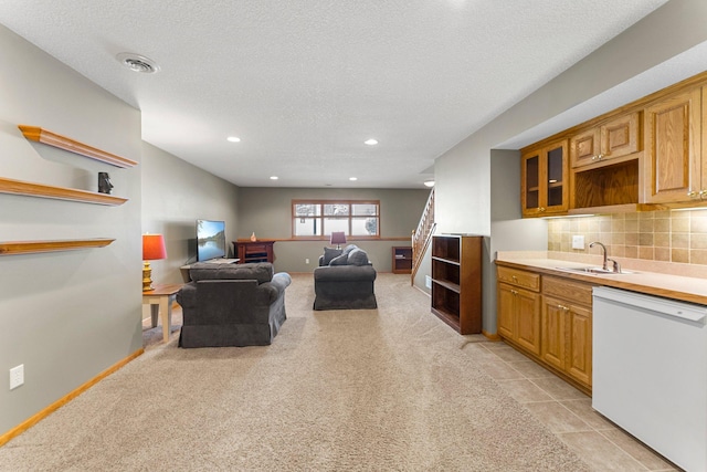 kitchen featuring tasteful backsplash, open shelves, and dishwasher